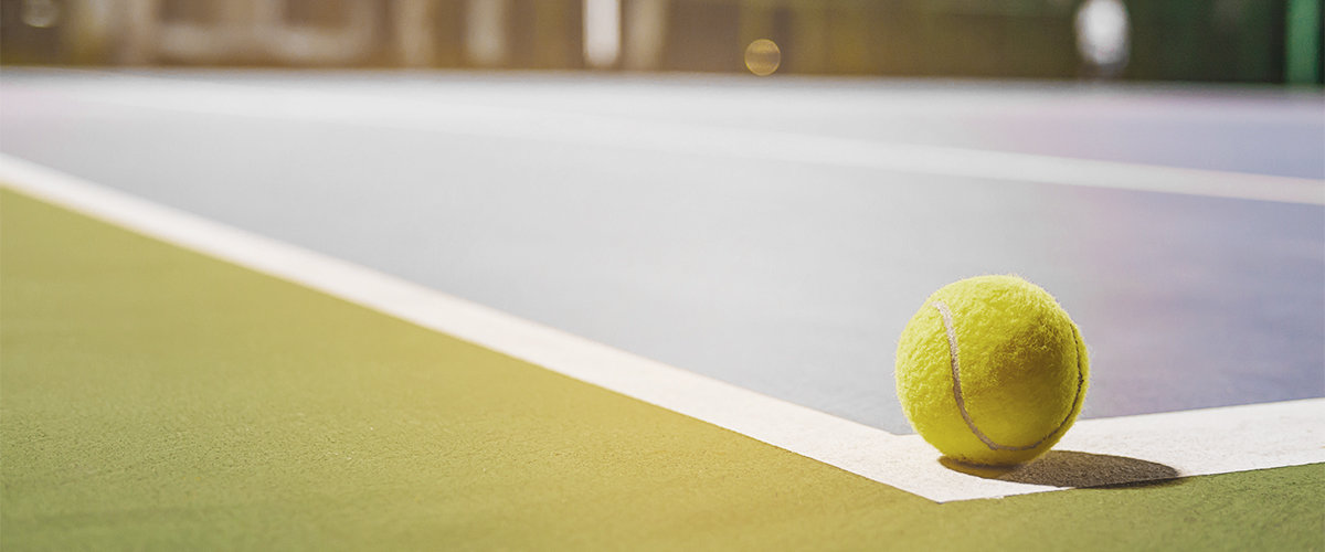 Close up on a tennis ball on a court